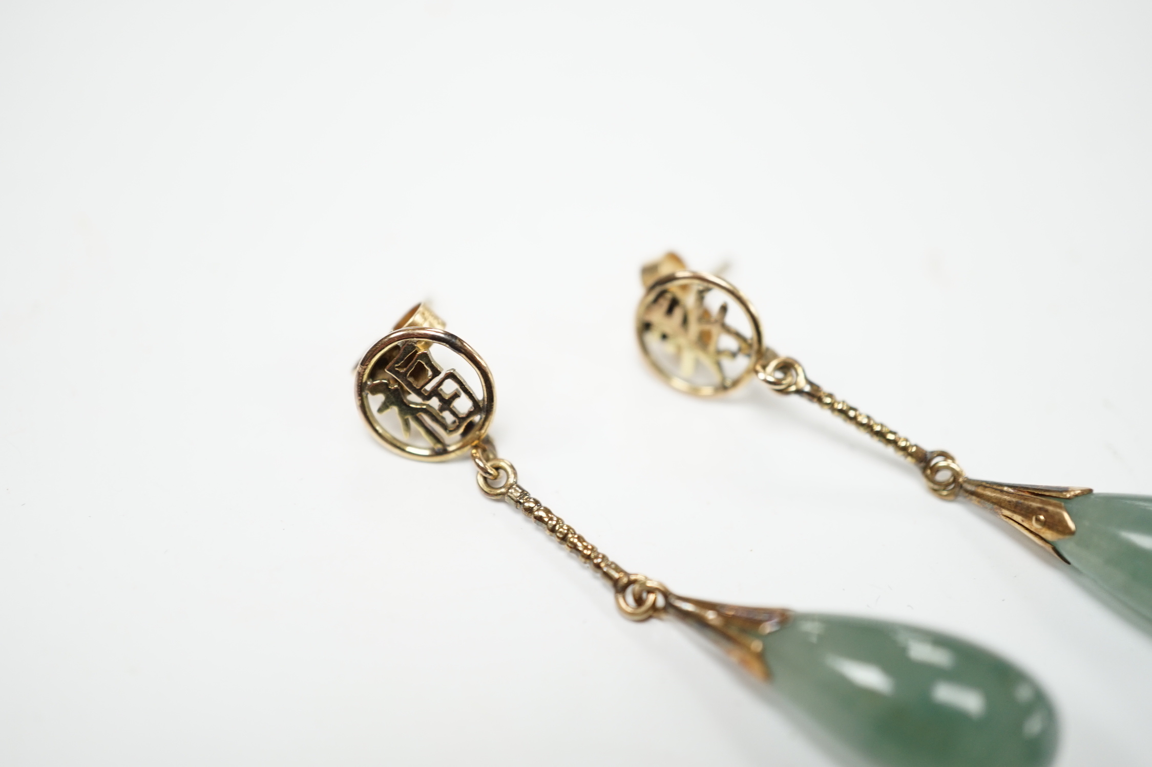 A pair of Chinese yellow metal and jade set drop earrings, 45mm, gross weight 5.7 grams.